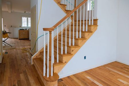 wooden-planks-around-pole-stairs-handrails-renovat-2022-11-12-11-25-36-utc.jpg