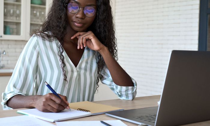 young woman working on a laptop