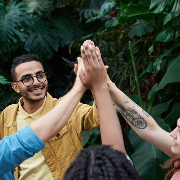 community doing a group high-five