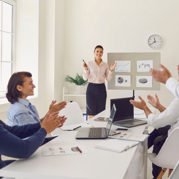 employees smiling at meeting