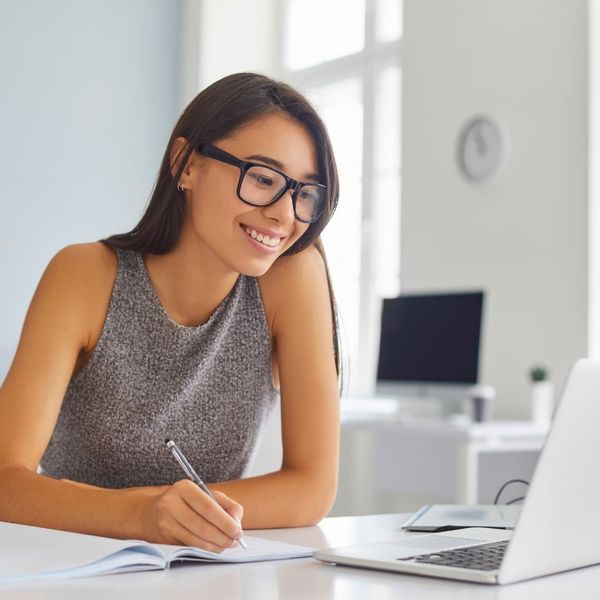 A woman smiling while working