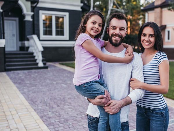 Family in front of hom Family in front of hom