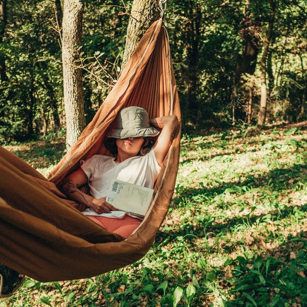 a woman resting in a hammock Why a Professional Mosquito Control Plan (4).jpg