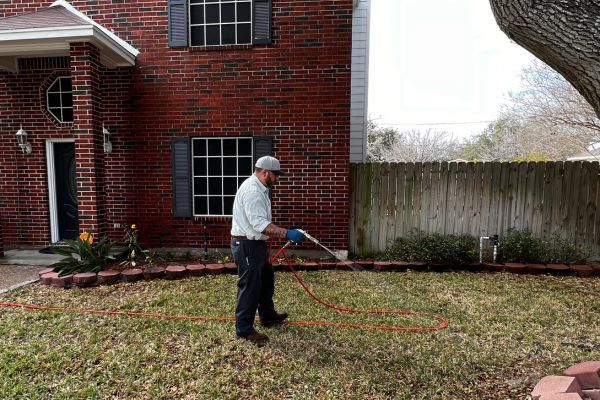 a man spraying a lawn About Us (3).jpg