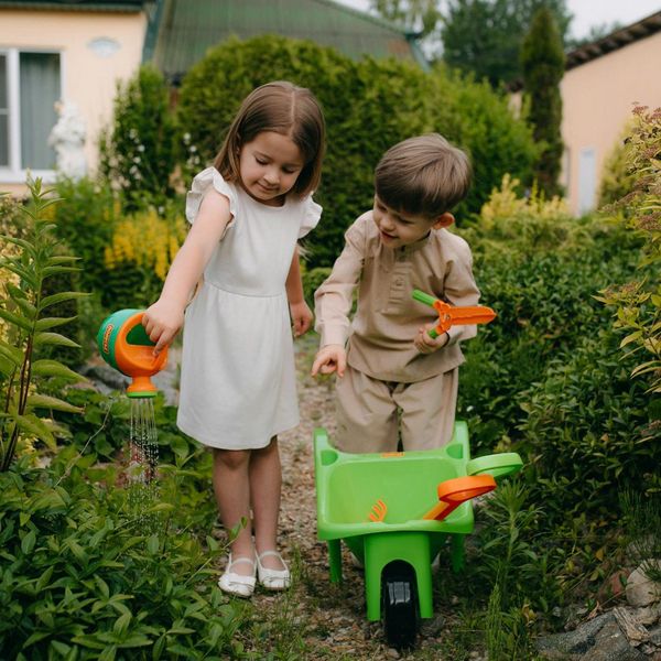 kids playing in a garden Why a Professional Mosquito Control Plan (2).jpg