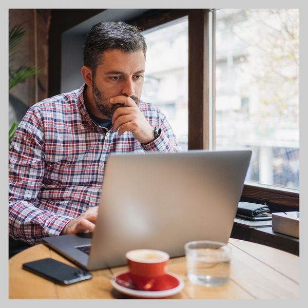 owner looking at computer 