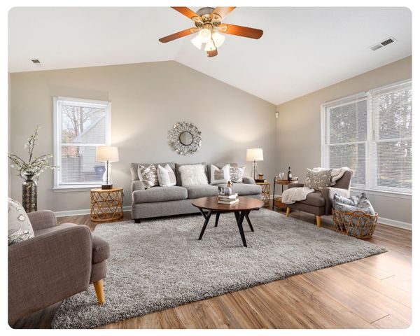 living room with clean area rug in the middle living room with clean area rug in the middle