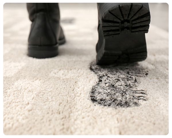 man with muddy boot walking on rug man with muddy boot walking on rug