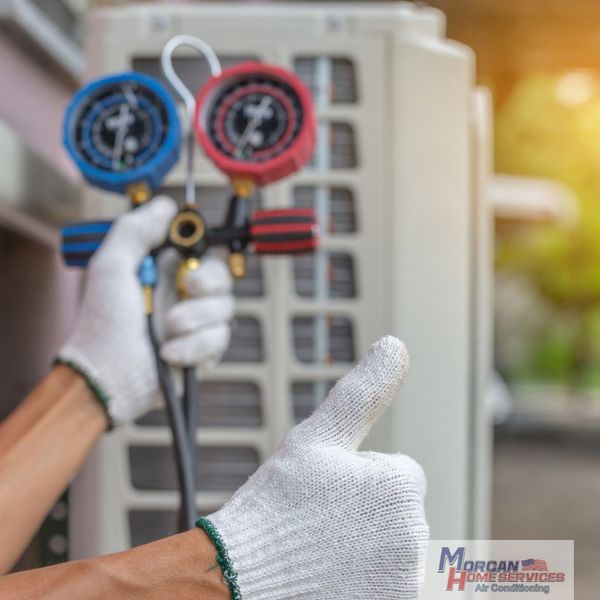 contractor working on an HVAC tune-up contractor working on an HVAC tune-up
