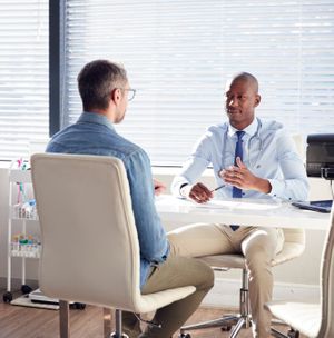 A doctor speaking with a patient