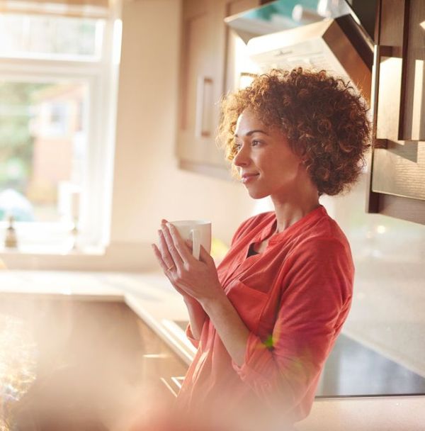 A content woman drinking tea