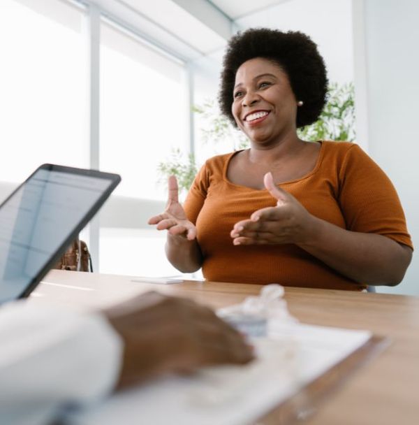 A woman speaking during a doctor consultation