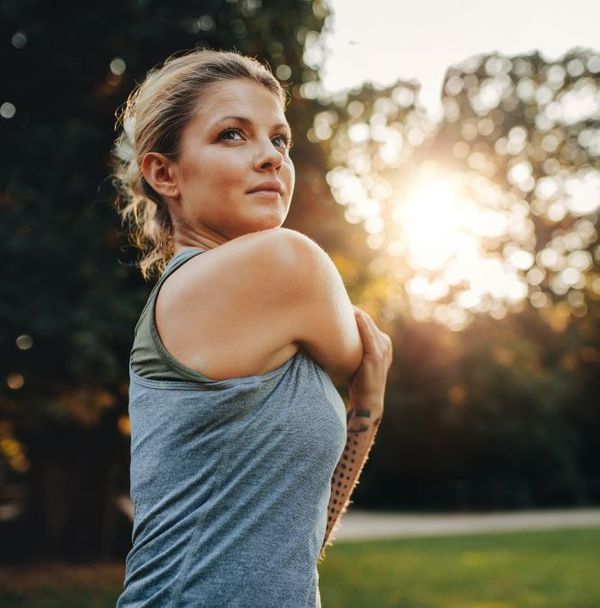 A woman stretching outside