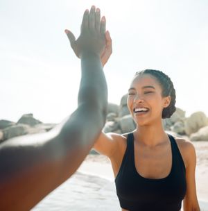 A woman celebrating her detox cleanse