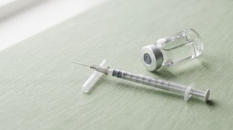 Glass vial and syringe representing the KLOW peptide blend, used in a wellness clinic explainer article