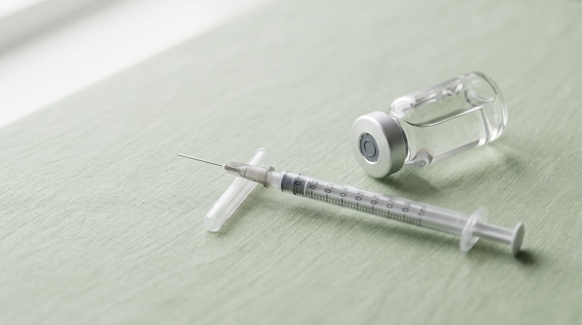 Glass vial and syringe representing the KLOW peptide blend, used in a wellness clinic explainer article
