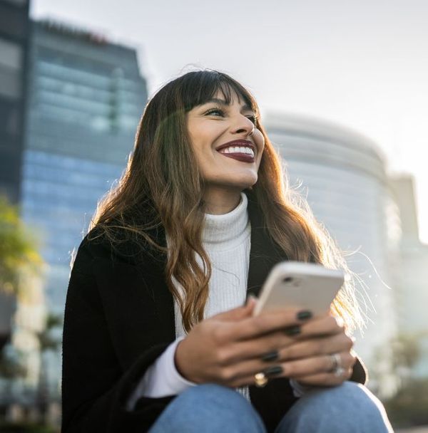 A content woman sitting outside