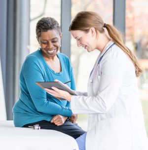 A doctor and patient walking through a detox and cleanse protocol