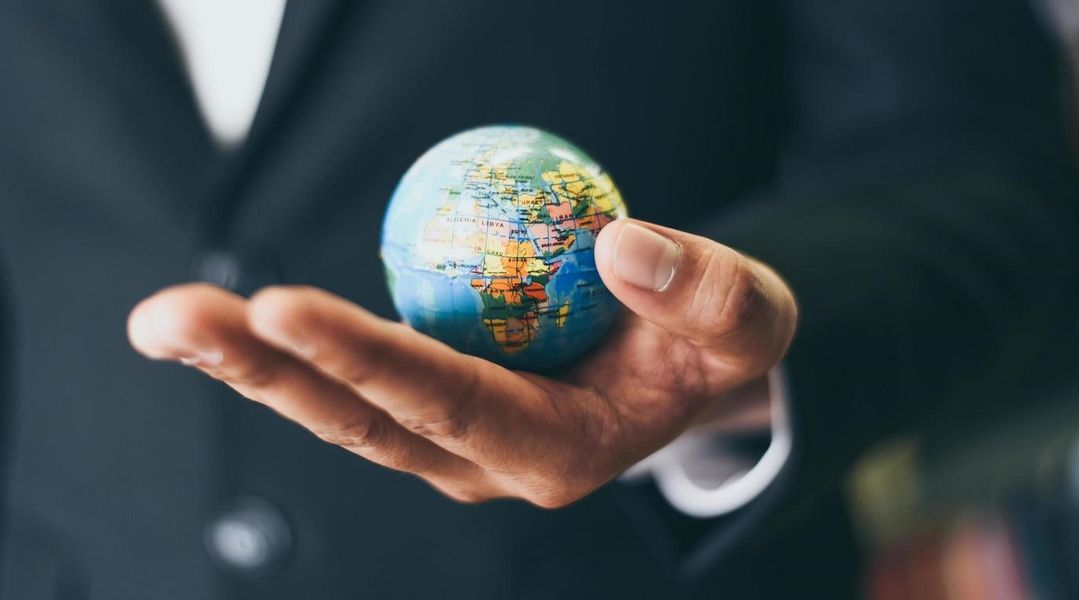business-man-holding-earth-globe-model-in-hand-and-business-global-and-travel-around-the-world-or-save-the-world-concept-free-photo - Copy.jpg