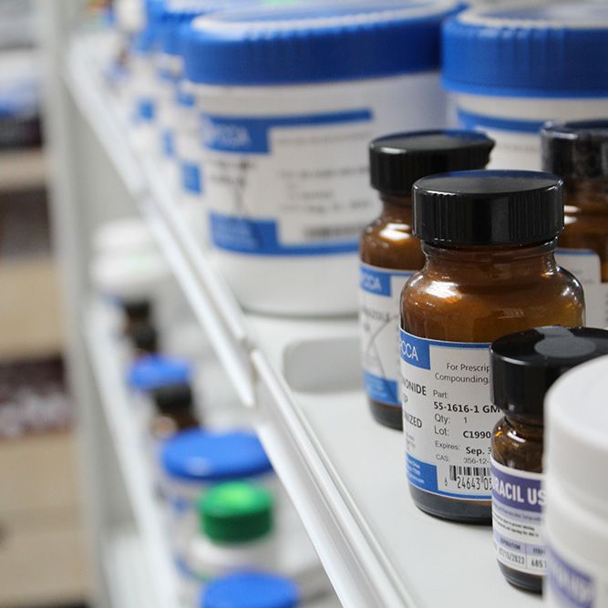 A closeup of medications on a shelf