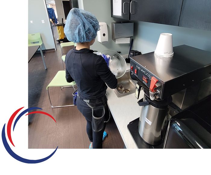 Woman cleaning break room