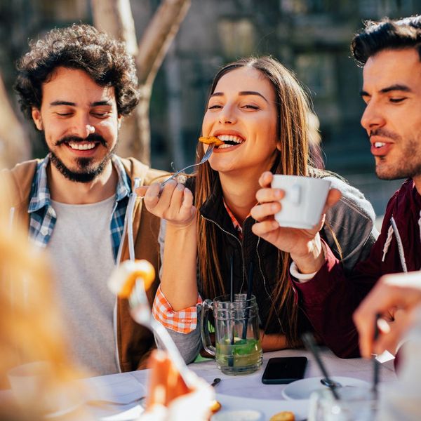 An image of friends eating at a restaurant.