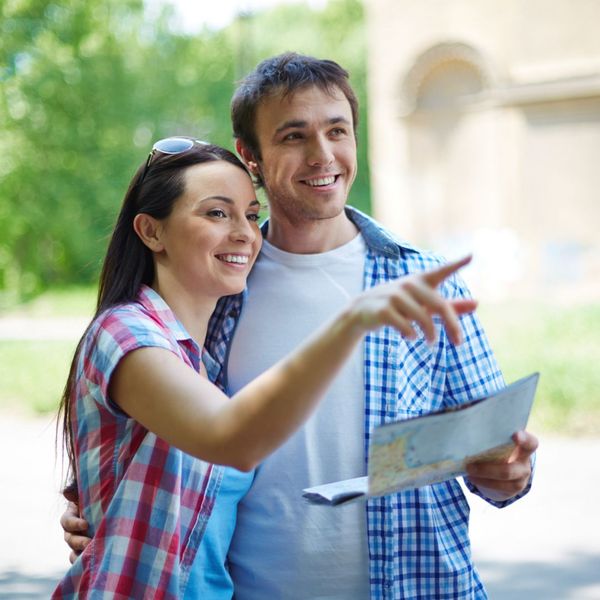 An image of a couple using a map.