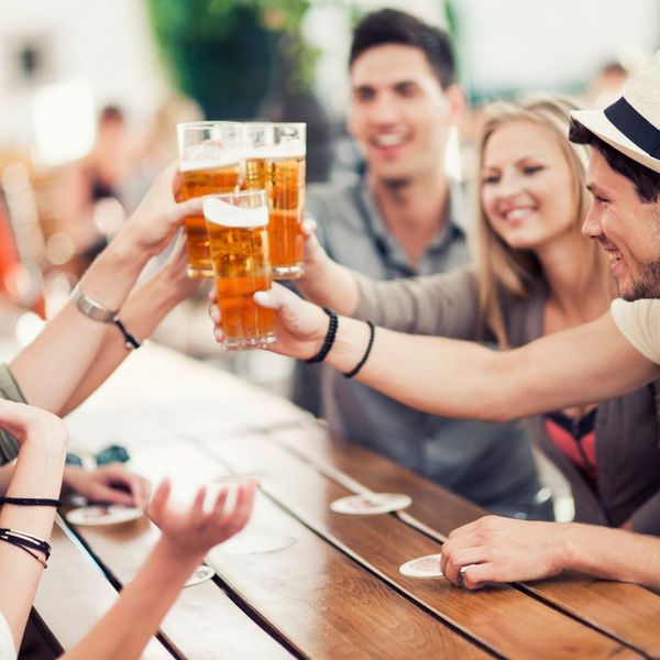 group of friends cheering beers