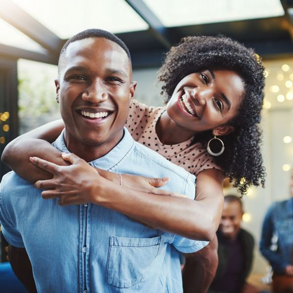 An image of a couple smiling at the camera.