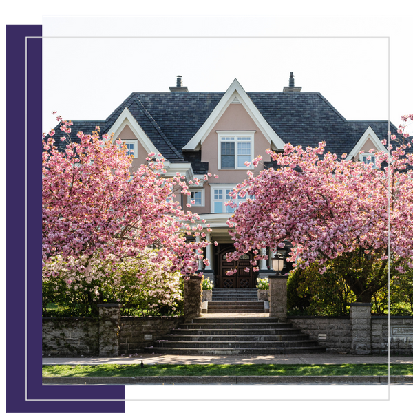 Image of a house with two beautiful trees in front