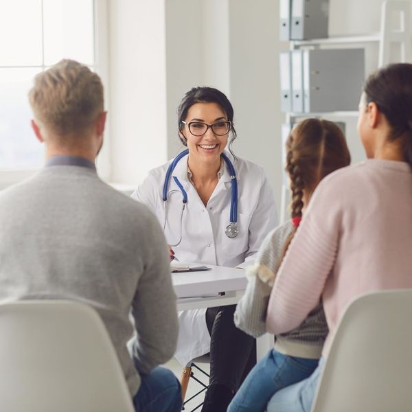 pediatrician talking to a family