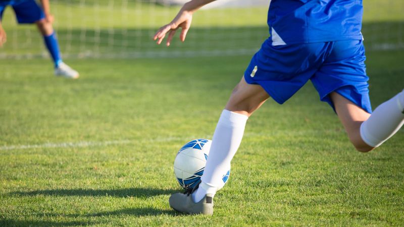 kid playing soccer