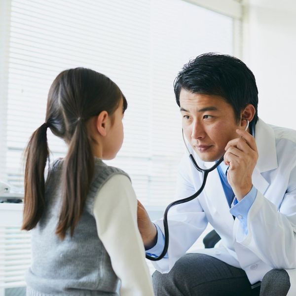 pediatrician evaluating a child