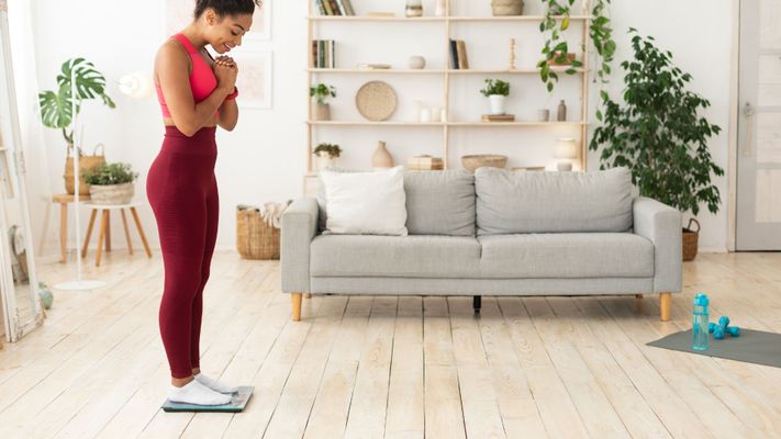 woman weighing herself