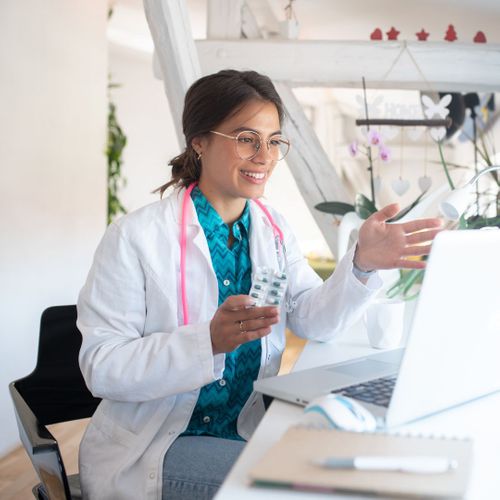 A nutritionist on a video call explaining a medication