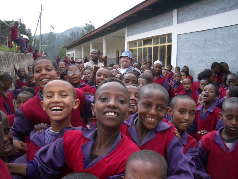 Students smiling outside of school