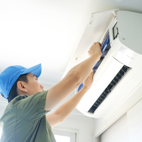 Worker installing an AC unit