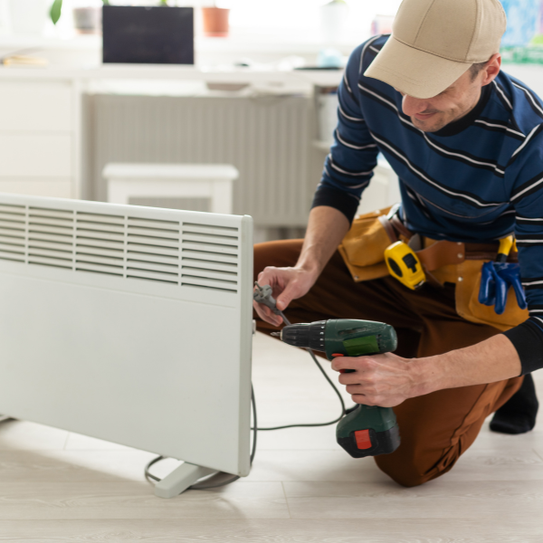 Worker fixing an AC unit