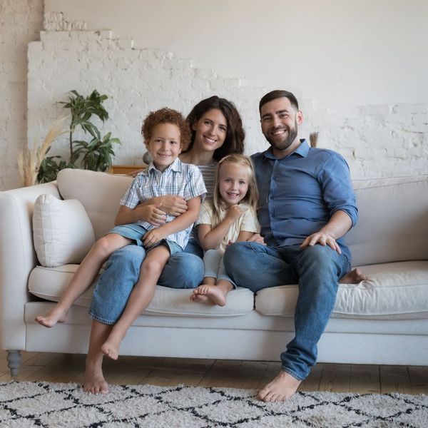 happy family sitting on the couch