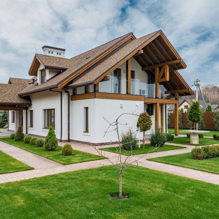 A modern home with a painted balcony