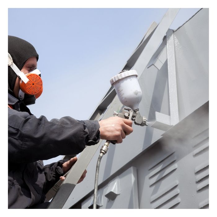 man painting new construction