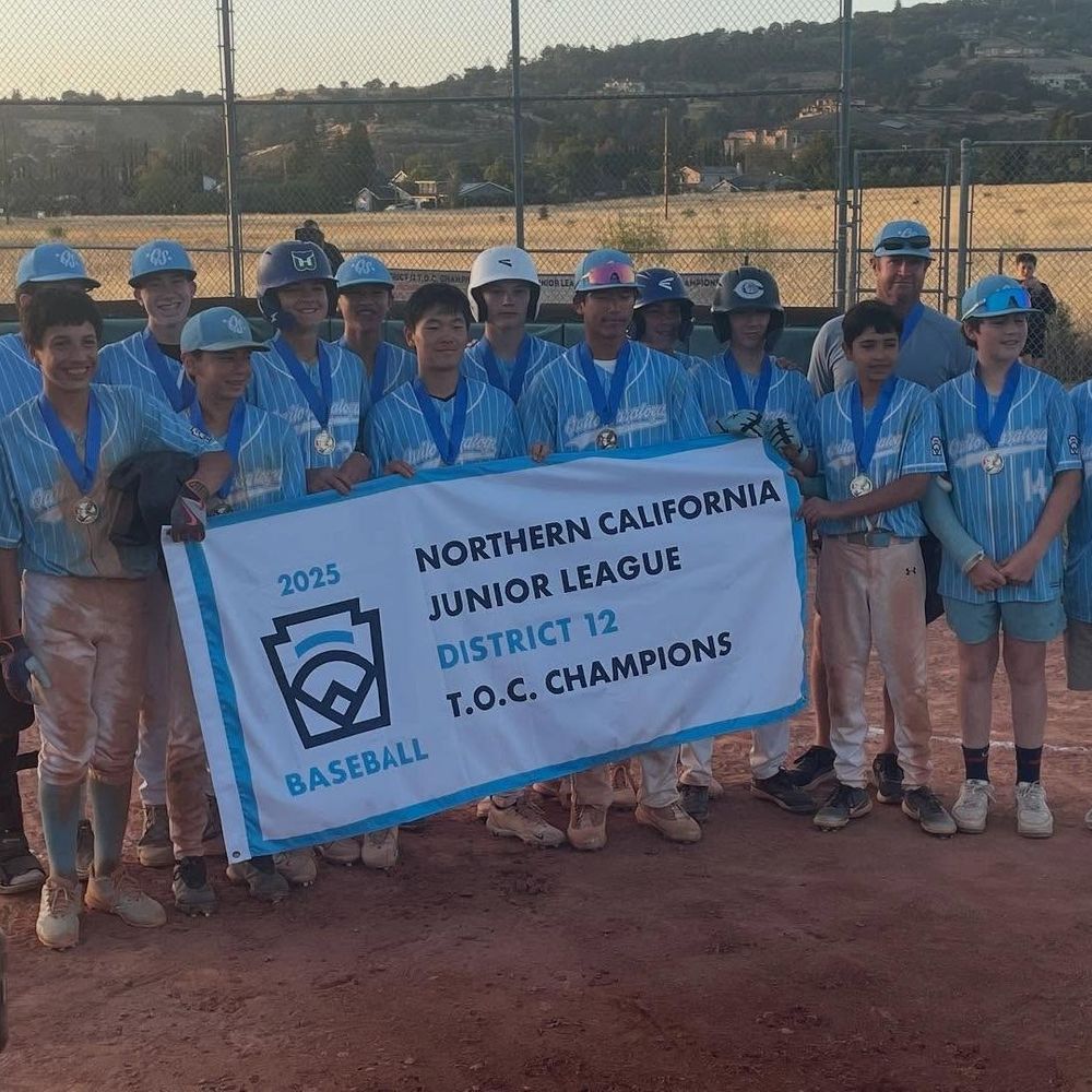 The Junior League with their 2025 champion poster