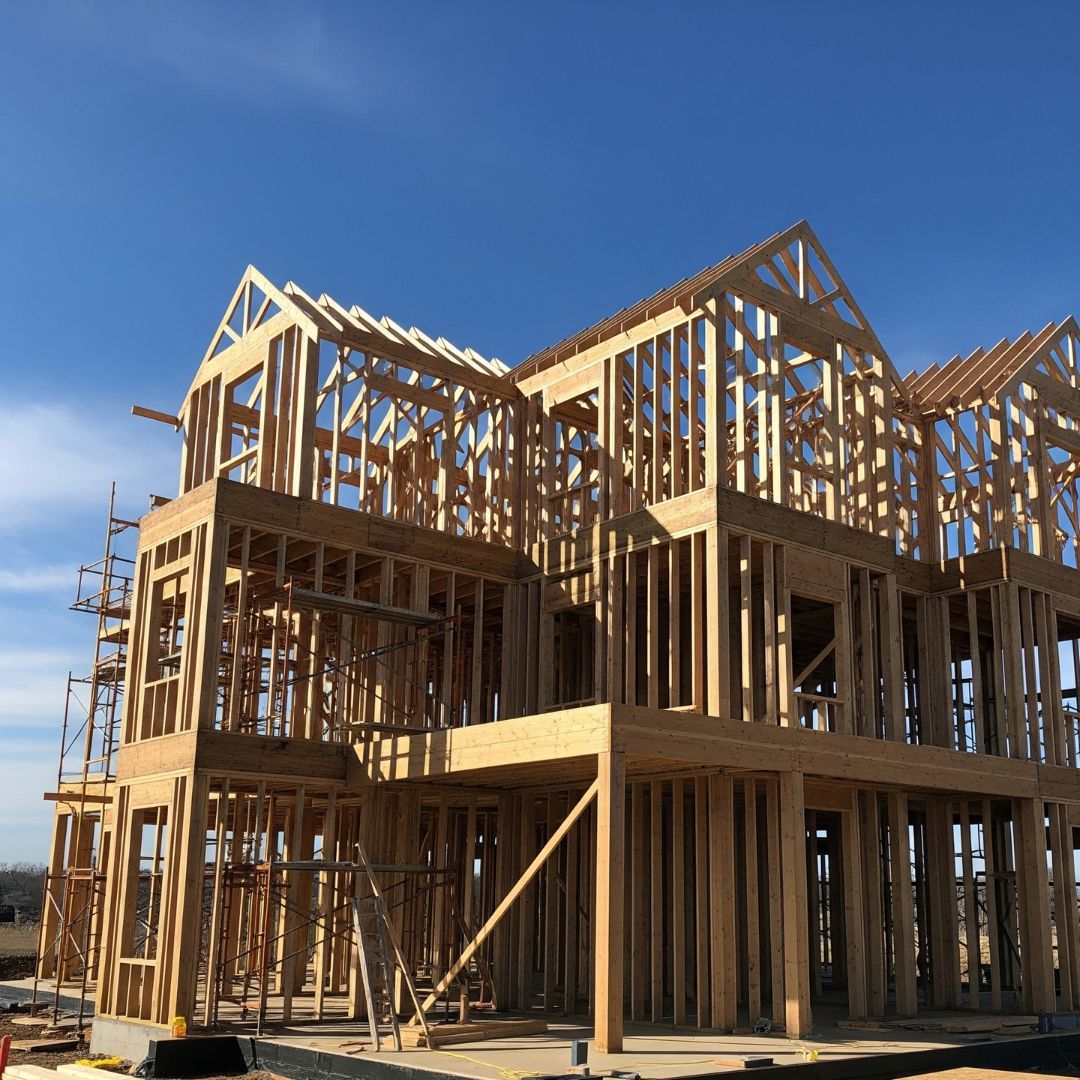 The wood framing of a luxury home during the construction phase.