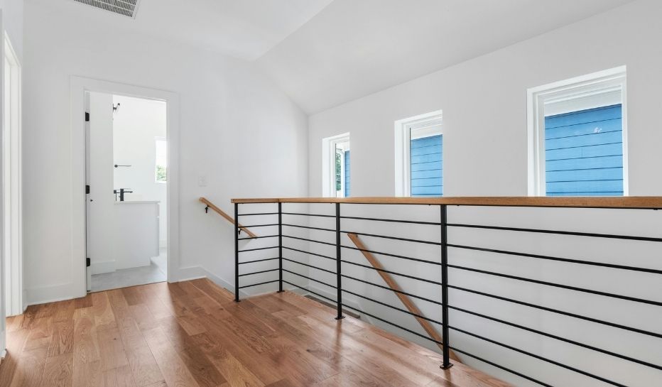 stairway with modern black railing