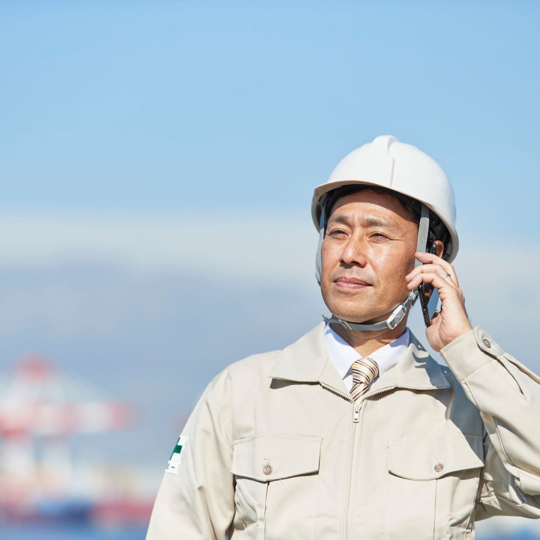 A construction project manager communicating an update from the job site.