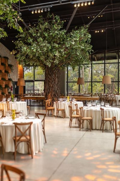 restaurant dining room with tables covered in white linens