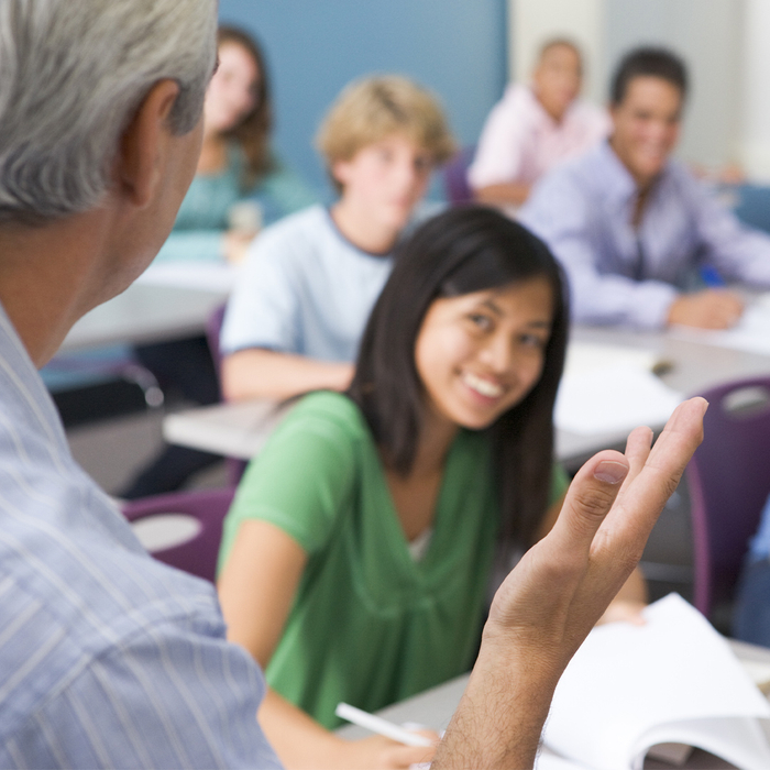 a teacher in front of middle school students cirriculum.jpg