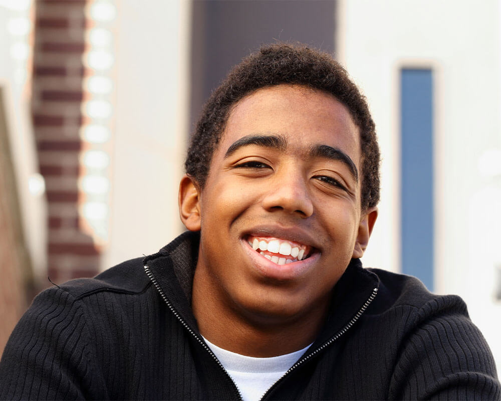 teenager smiling at camera