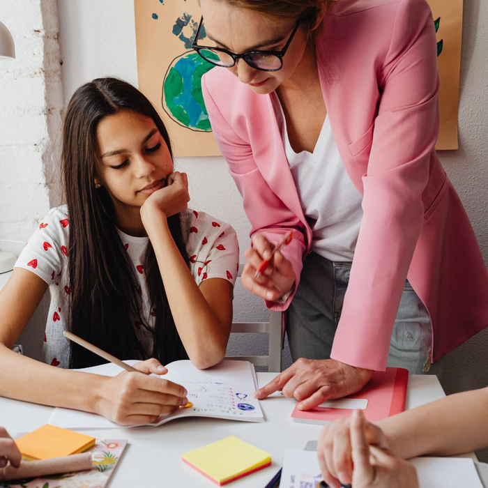 teacher helping student