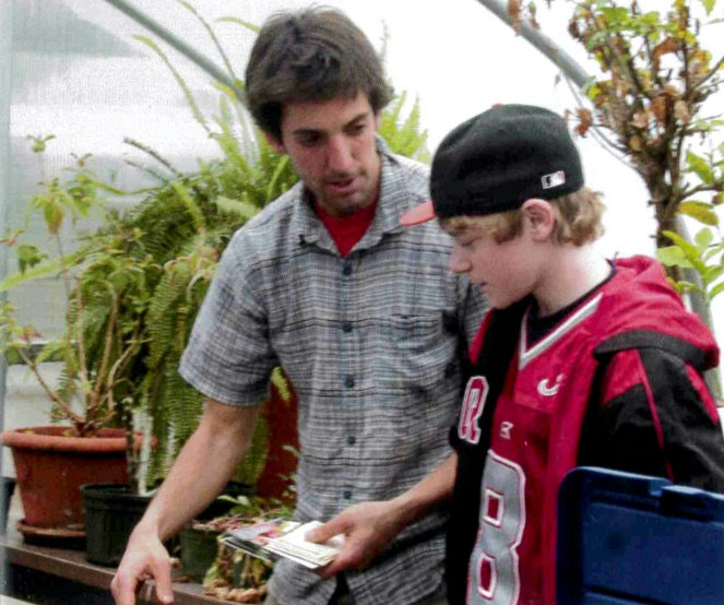Student and counselor in the greenhouse